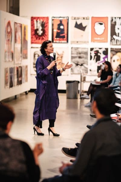 A speaker addressing a seated audience