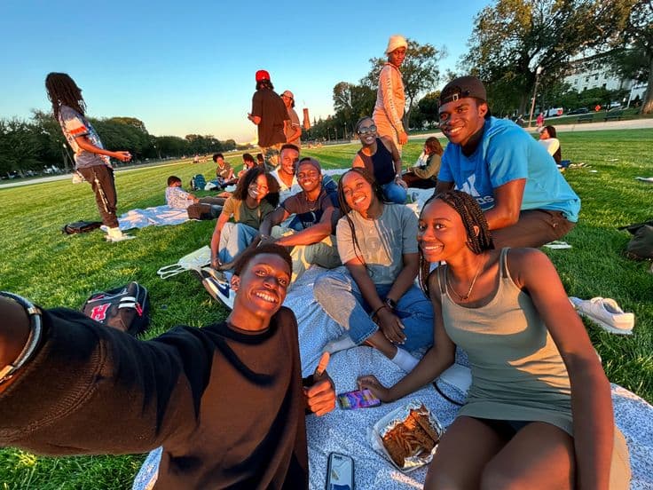 Friends gathered in a park at golden hour